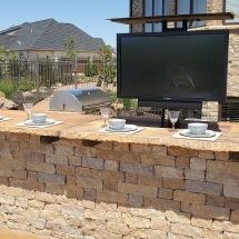 outdoor kitchen with tv